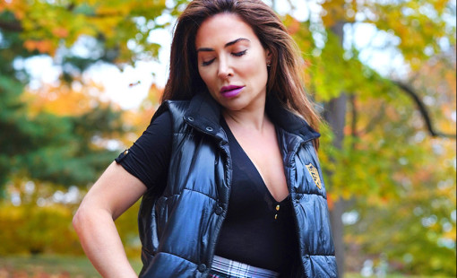 Woman against a backdrop of autumn leaves. 